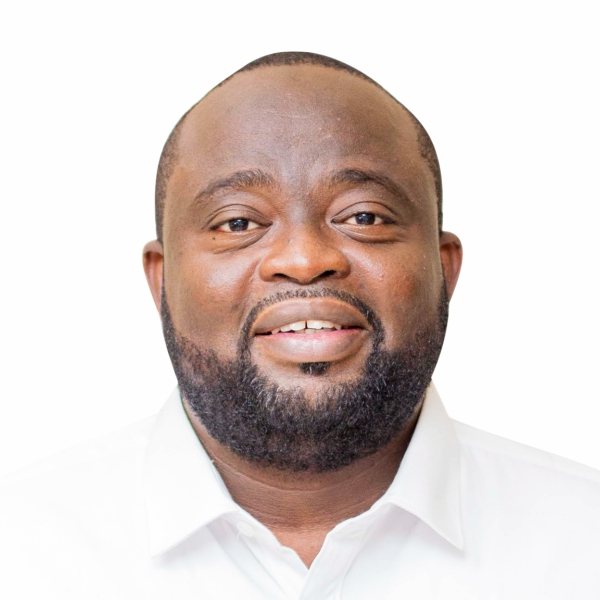 Portrait of Hon. Emmanuel Nii Okai Laryea in a white shirt, smiling